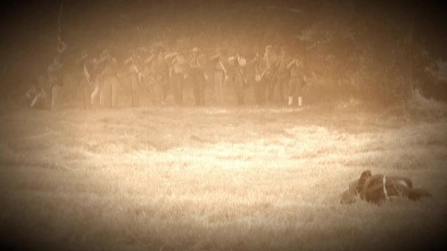 Union soldiers firing across battlefield (Archive Footage Version)