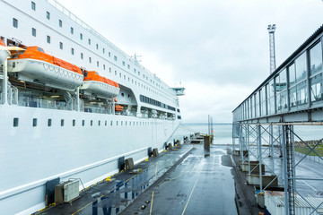 Fototapeta premium Luxury cruise ship sailing from port