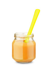 Jar of baby food with spoon