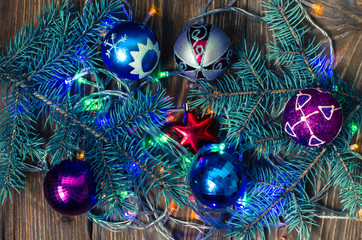 Branches of blue spruce and Christmas toys.