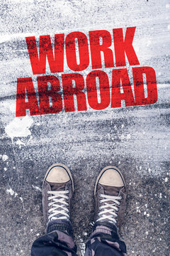 Work abroad title on the pavement