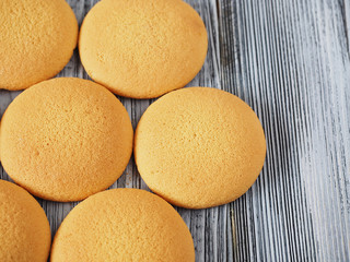 Tasty biscuits on the wooden background