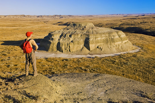 Hiker in the Killdeer Badlands, East Block, Grasslands National Park, Saskatchewan, Canada