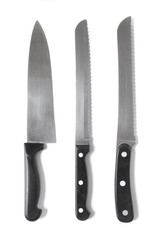 Assorted sharp kitchen knives isolated on a white background