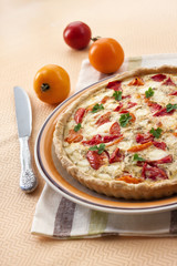 Tart with salted sheep cheese and tomatoes