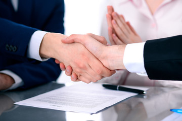 Business people shaking hands finishing up a meeting