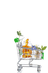 Green Shopping trolley with pills and Herbal medicine