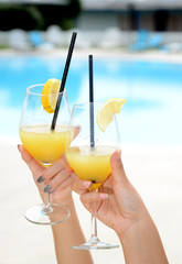 Woman hands with glasses with cocktails