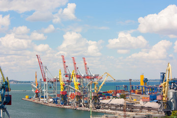 Naklejka premium Cranes and containers at sea cargo port