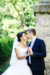 Groom holds bride