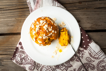Healthy food - pumpkin muffin with oatmeal. On the rustic table, top view, copy space