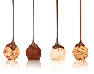 Set of sweets poured melted chocolate on a white background