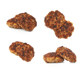 Couple of small hand made cutlets isolated over white background