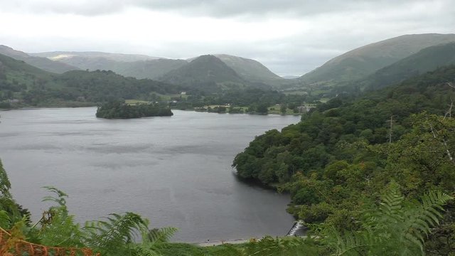 Landscape of Lake District mountains surrounding Grasmere lake.Shot from Loughrigg Terrace above the dam on Rothay river