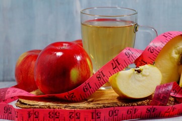 fresh apples, apple juice or apple cider vinegar in your diet - soft focus
