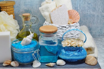 Fototapeta na wymiar SPA - Aromatic sea salt and scented soap, scented candles and massage oil and accessories for massage and bat 