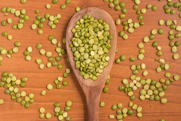 Dried Green Peas into a spoon