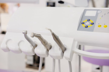 The image of a dental drilling machine close up