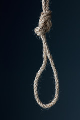 Knot rough jute rope closeup on black