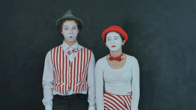 Two young mime crying