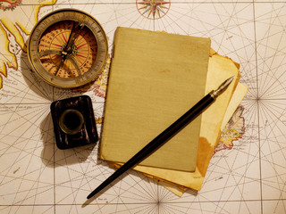 Captain's journal and compass