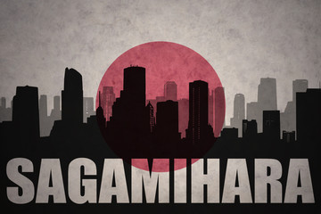 abstract silhouette of the city with text Sagamihara at the vintage japanese flag background