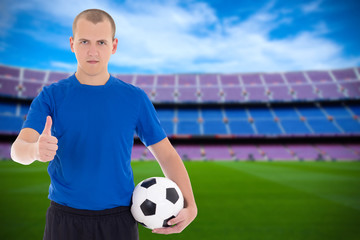 football player with ball on field of stadium