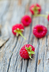 raspberry on wooden surface