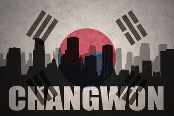 Fototapeta premium abstract silhouette of the city with text Changwon at the vintage south korea flag background