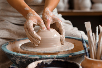 Potter teaches how make clay pot - obrazy, fototapety, plakaty