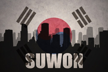 abstract silhouette of the city with text Suwon at the vintage south korea flag background