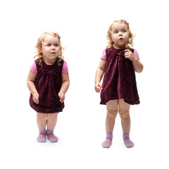 Young little girl jumping over isolated white background
