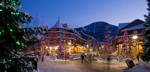 The lights of Christmas sparkle in Whistler Village on a winter evening.
