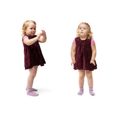 Young little girl standing over isolated white background