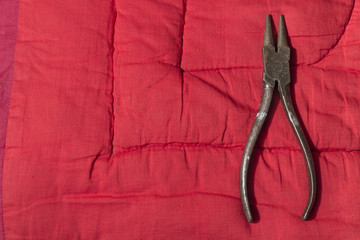 pliers on the fabric