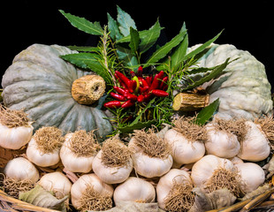 Garlic and other typical autumn vegetables in a basket