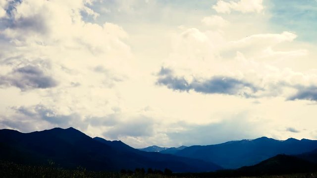 taymlaps clouds and fog passes through the clouds. It Altai, Kazakhstan or Mongolia