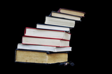 Stack of books isolated on black background
