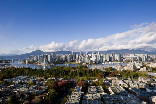 Burrard and Cambie Bridges, city skyline with new retractable roof on BC Place Stadium, False Creek, Vancouver, British Columbia, Canada
