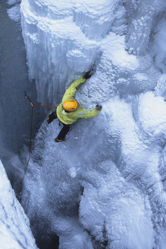 An ice climber making his way up Tokumm Pole WI 5+, Kootenay National Park, British Columbia, Canada