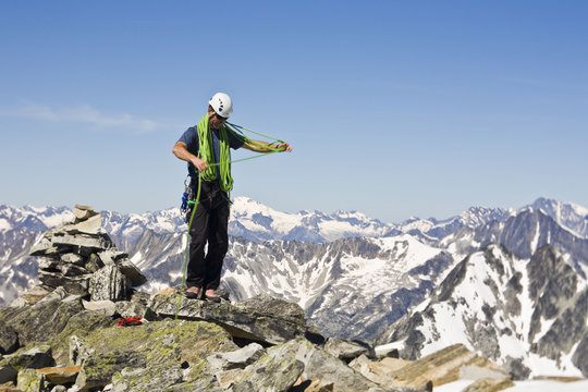A mountain climber ascends Mt Uto in Roger's Pass,  Glacier National Park, BC