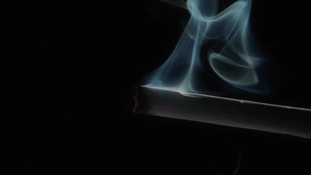 Cigarette Smoking, detail footage on Black Background