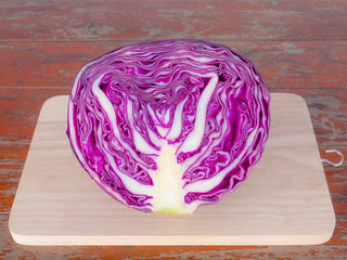 Obraz premium Vegetables, Purple cabbage on cutting boards on Wooden table . 