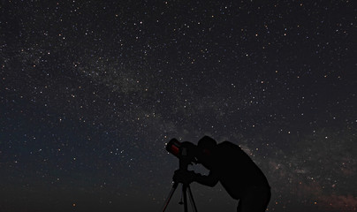 Person stargazing in Grasslands National Park, a dark sky preserve, Saskatchewan.