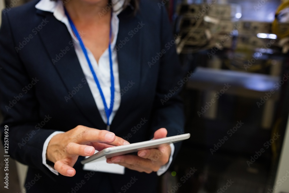 Aufkleber technician using digital tablet