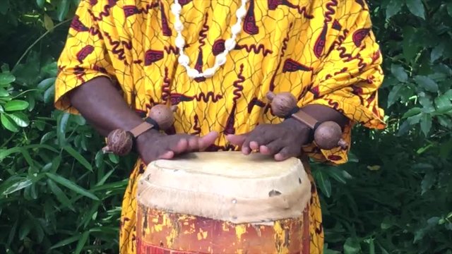 Black musician plays the drums