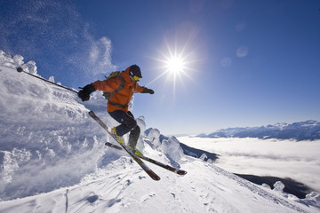 Young man telemark-skiing at Revelstoke Mountain Resort, BC, Canada. (model release #08113)