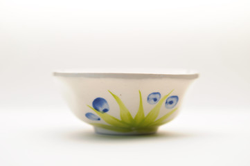 Chinese "longevity" bowl and spoon with traditional design and Chinese calligraphy