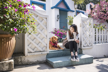 Girls and golden retriever