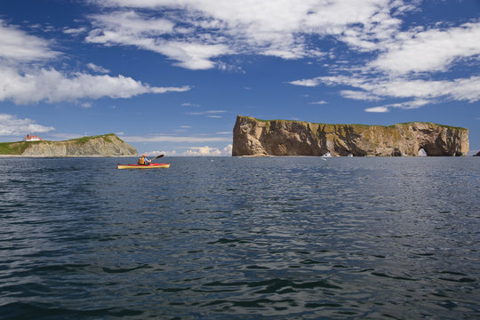 Sea-kayaking near Perce Rock, Gaspe, Quebec, Canada.